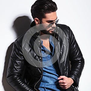 Side view of a dramatic fashion male model posing