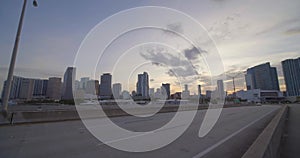 Side view driving plates Downtown Miami from Port Boulevard Bridge 4k 60p