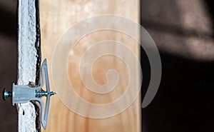 Side view of a drywall mount anchor and screw