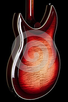 Side View of Electric Guitar in Fireglo with German Carve on Flamed Maple