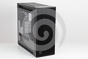 Side view of empty big tower, PC case, chassis, tempered-glass left panel has a mesh window to aid in graphics-card ventilation