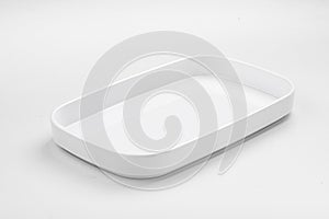 Side view on empty white plate on white background