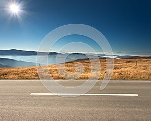 Side view of empty highway in mountain range