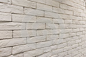 Side view of empty white brick wall in room. textured and background