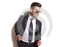 Side view of a fashion business man posing