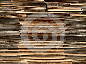side view of folded brown paper box stack prepare for using.