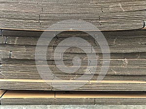 side view of folded brown paper box stack prepare for using.