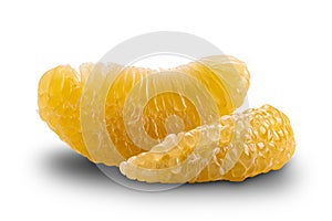 Side view of fresh peeled pomelo fruit on white background