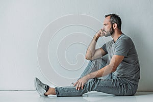 side view of frustrated bearded middle aged man
