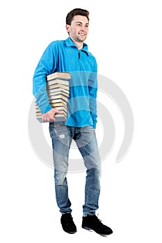 Side view of going man carries a stack of books.
