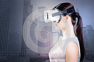 Side view of gorgeous woman using VR goggles photo