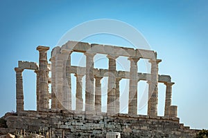 side view of the Greek temple of Poseidon in Cape Sounion , Greece