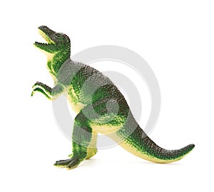 Side view green plastic dinosaur toy on white background