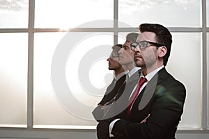 Side view.a group of business people looking at a copy space