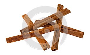 Side view of a group of cinnamon sticks isolated on a white background