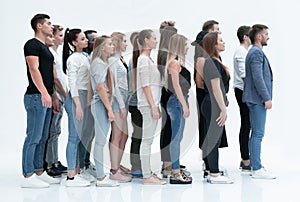 Side view. a group of diverse young people standing in a row