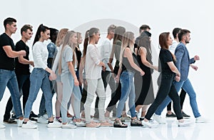 Side view. a group of diverse young people standing in a row