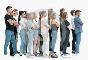 side view. a group of diverse young people standing in a row