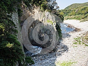 Side view of Hakusan Domon natural arch on cape Ashizuri