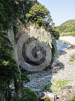Side view of Hakusan Domon natural arch on cape Ashizuri