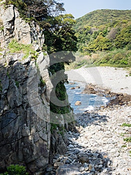 Side view of Hakusan Domon natural arch on cape Ashizuri