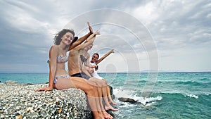 Side view of happy young teens having party singing and clapping hands