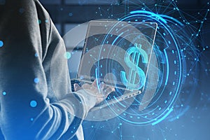 Side view of headless hacker holding laptop with creative round dollar sign on blurry blue polygonal background. Crypto, hacking,