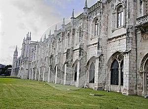 Side view of the historic, Gothic St Jerome Monastery with arched widows and towers.