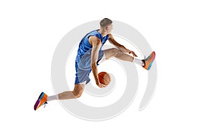 Side view image of young man, basketball player in motion, training, playing isolated over white background. Sport