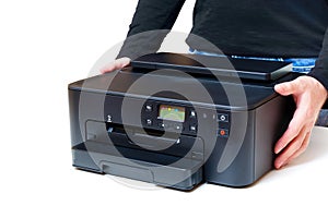 Side View of Inkjet Printer in Hands on White Background