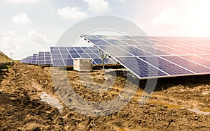 Side view of Installed row of Photovoltaic solar panels / modules at solar power station