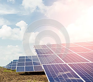 Side view of Installed row of Photovoltaic solar panels / modules at solar power station