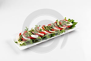 Side view on isolated classic caprese salad photo