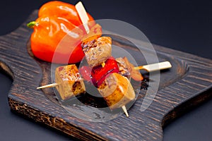 Japanese Chicken Skewers with bell pepper. Yakitori Chicken on wooden board with vegetables