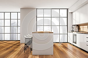 Side view on kitchen room interior with empty white wall