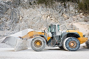 Side view of large and heavy wheel mounted front loader