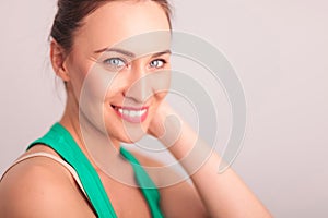 Side view of a laughing woman with blue eyes