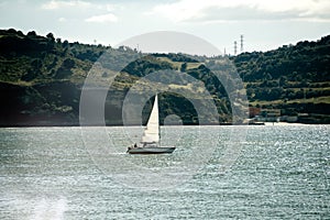 Sailing boat on blue water of harbor