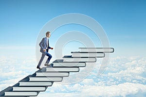 Side view of man climbing book steps on bright blue sky with clouds background. Mock up place. Growth and education concept