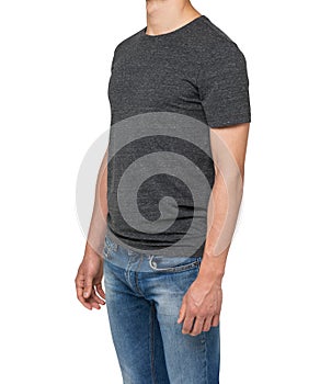 Side view of a man in a dark grey t-shirt and denims.