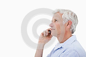 Side view of a man making a phone call