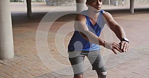 Side view man with prosthetic leg doing squats