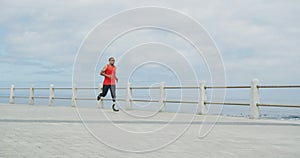 Side view man with prosthetic leg running