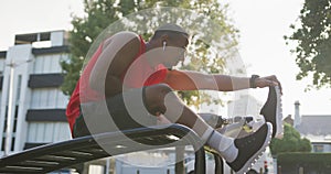 Side view man with prosthetic leg stretching