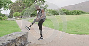 Side view man with prosthetic leg stretching