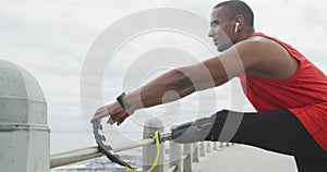 Side view man with prosthetic leg stretching