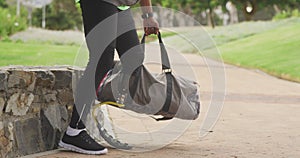 Side view man with prosthetic leg walking