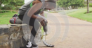 Side view man putting on his prosthetic leg