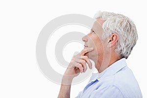 Side view of a man thinking