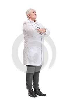 Side view of mature doctor examining lungs of an imaginary patient with stethoscope